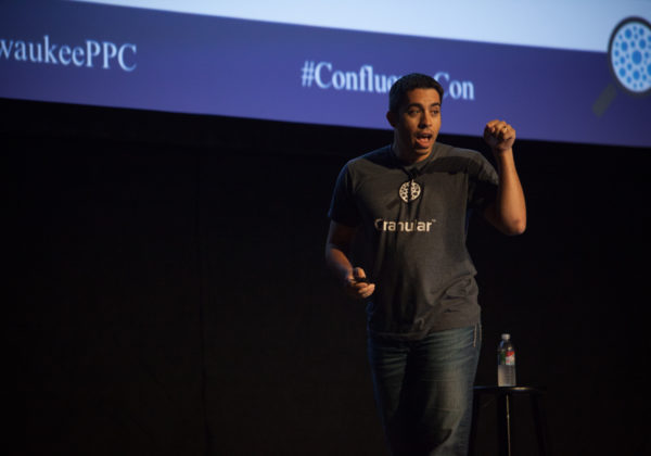 Joe Martinez speaking at Confluence 2017 wearing a Granular tshirt and jeans
